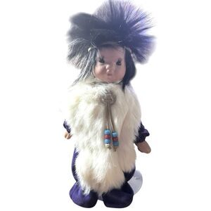 Collectible doll, dressed in traditional indigenous, attire, an Inuit/Eskimo